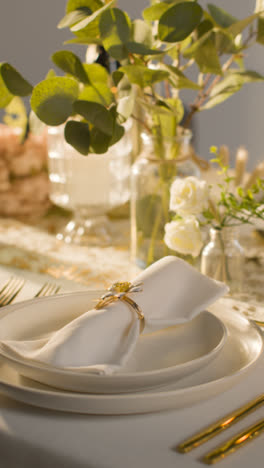 Vertical-Video-Close-Up-Of-Napkin-In-Ring-On-Vertical-Video-Of-Table-Set-For-Meal-At-Wedding-Reception